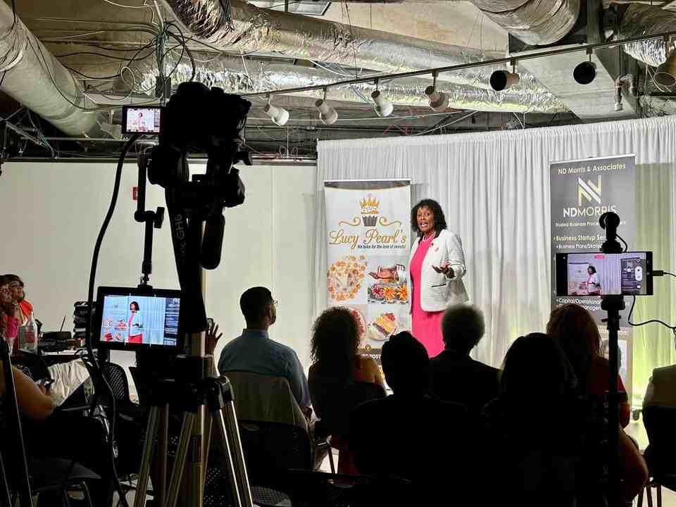 Nik Morris speaking to a live audience